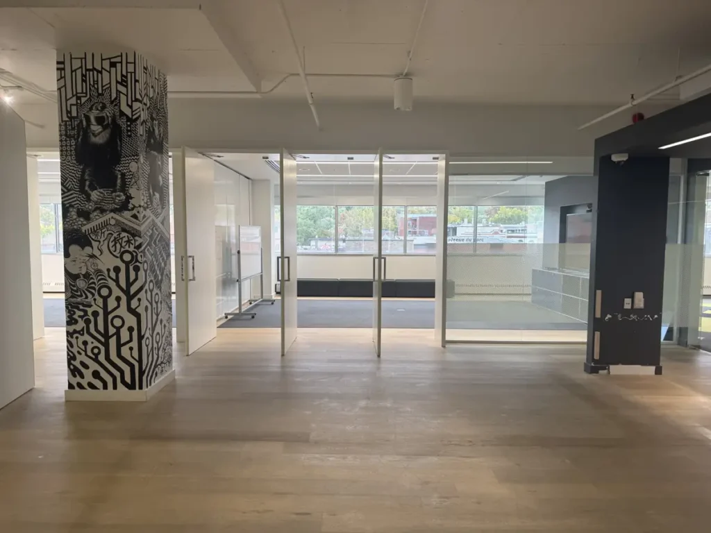 Open concept with wall column and glass-walled rooms – office space on the Plateau-Mont-Royal